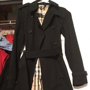 Burberry, Navy blue trench coat.